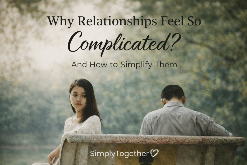 A couple sitting apart on a park bench, looking away from each other, representing emotional distance and complicated relationships.